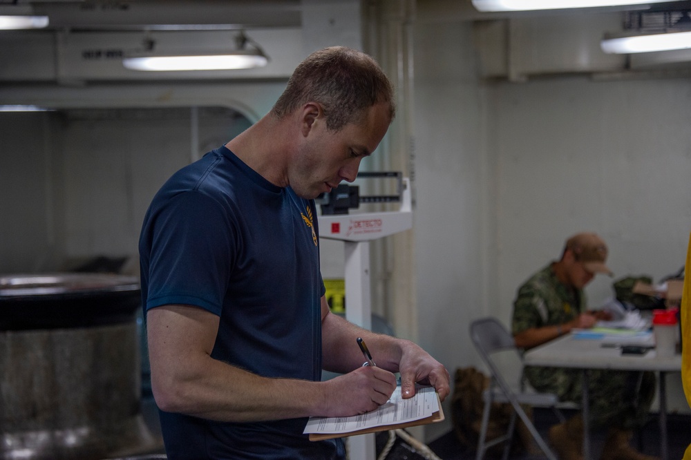 USS Carl Vinson (CVN 70) Sailors Conduct a Body Composition Assessment