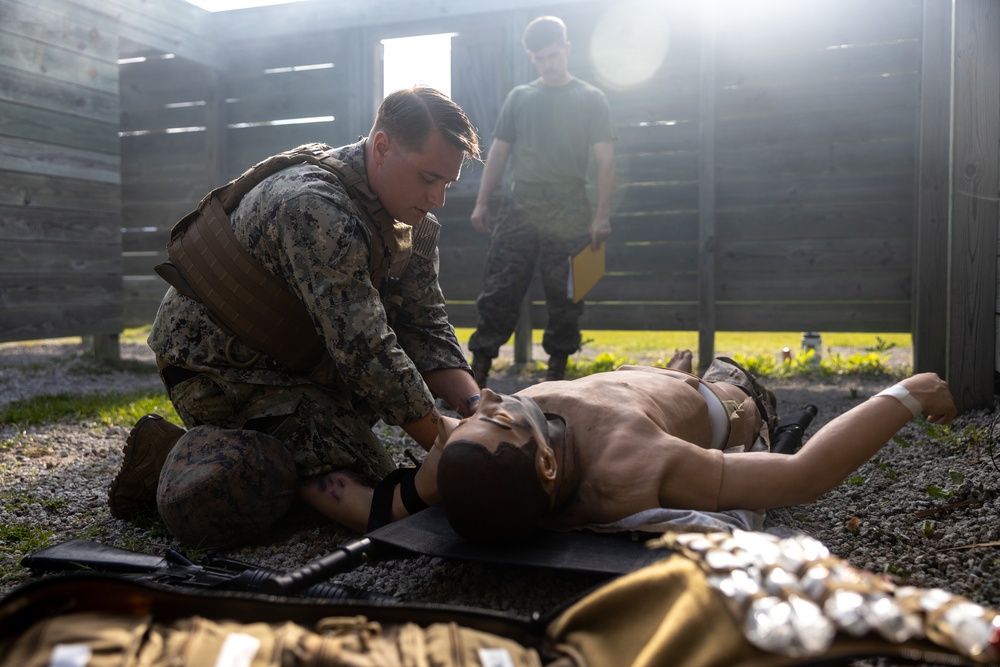 U.S. Navy Sailors conduct a Tactical Casualty Care Tier Three Instructor test