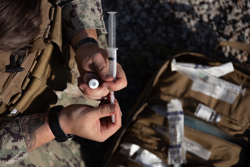 U.S. Navy Sailors conduct a Tactical Casualty Care Tier Three Instructor test