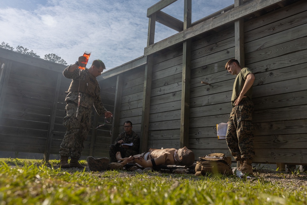 U.S. Navy Sailors conduct a Tactical Casualty Care Tier Three Instructor test