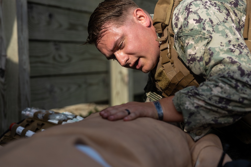 U.S. Navy Sailors conduct a Tactical Casualty Care Tier Three Instructor test