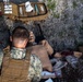 U.S. Navy Sailors conduct a Tactical Casualty Care Tier Three Instructor test