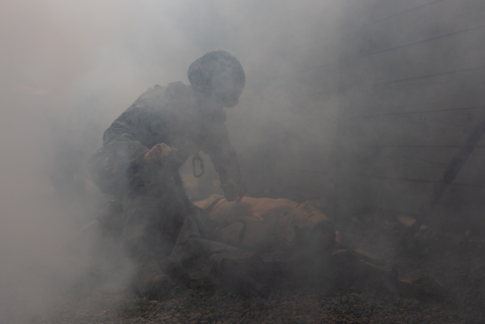 U.S. Navy Sailors conduct a Tactical Casualty Care Tier Three Instructor test