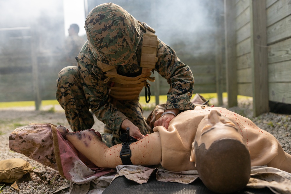 U.S. Navy Sailors conduct a Tactical Casualty Care Tier Three Instructor test
