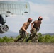 Aviation Ordnanceman mount LAU-61 G/A Digital Rocket Launcher onto an MH-60S