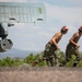 Aviation Ordnanceman mount LAU-61 G/A Digital Rocket Launcher onto an MH-60S