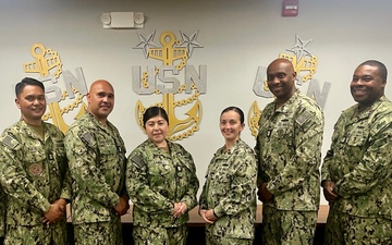 Master Chiefs stand together after finishing an advancement workshop