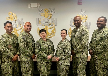 Master Chiefs stand together after finishing an advancement workshop