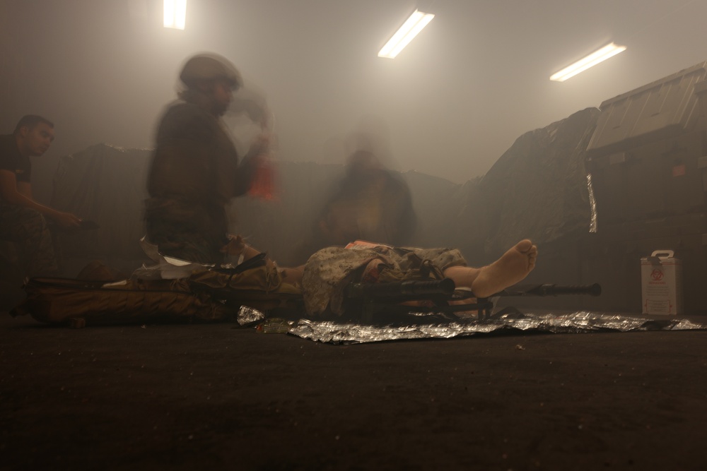 U.S. Navy Sailors Conduct a Tactical Casualty Care Tier Three Instructor Test