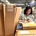 Supply clerk verifies shipping labels prior to release