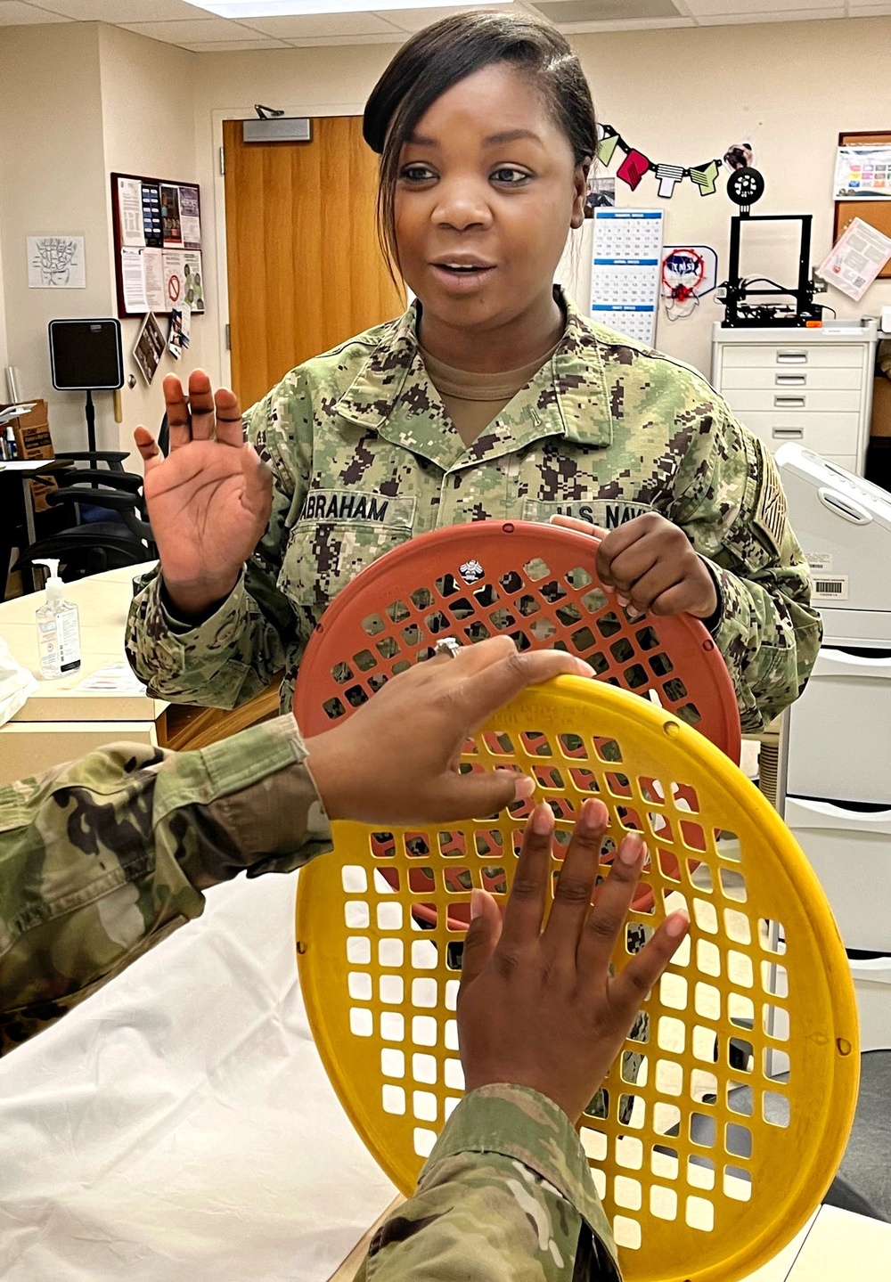 certified occupational therapist assistant performs stretch exercises with a patient