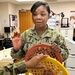 certified occupational therapist assistant performs stretch exercises with a patient