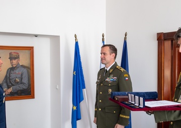 SEAC accepts Honorary Badge of Merit