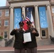 Chaplain administers oath to son during ROTC commissioning ceremony on UNC