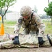 Command Sgt. Maj. Ryan Cole prepares a casualty for buddy-movement