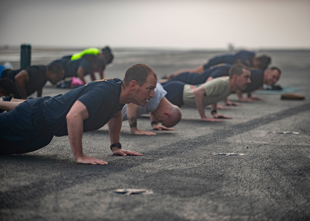 USS Ronald Reagan (CVN 76) Sailor commence flight deck PT