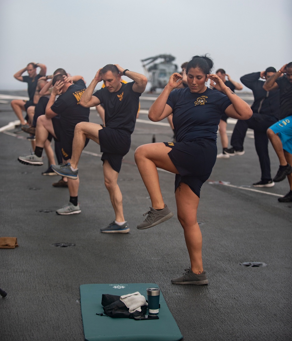 USS Ronald Reagan (CVN 76) Sailor commence flight deck PT