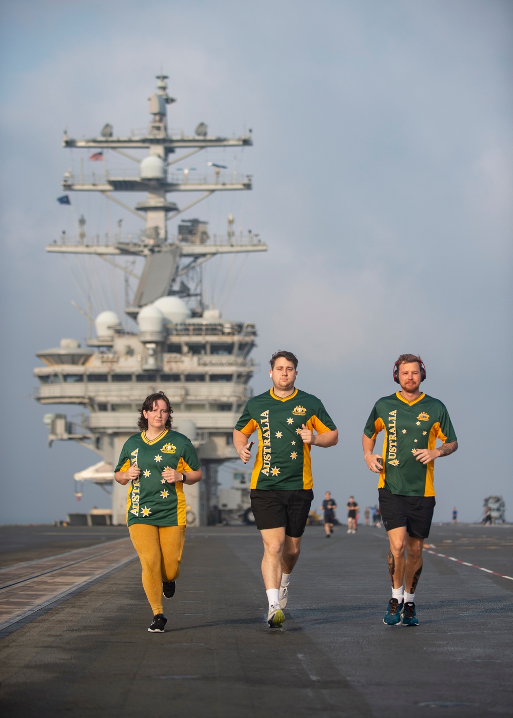 USS Ronald Reagan (CVN 76) Sailor commence flight deck PT