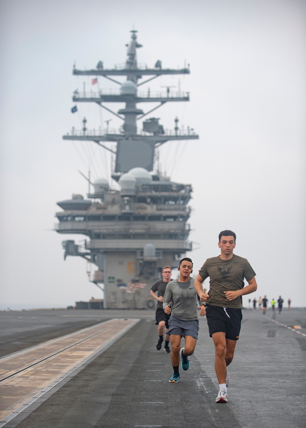 USS Ronald Reagan (CVN 76) Sailor commence flight deck PT