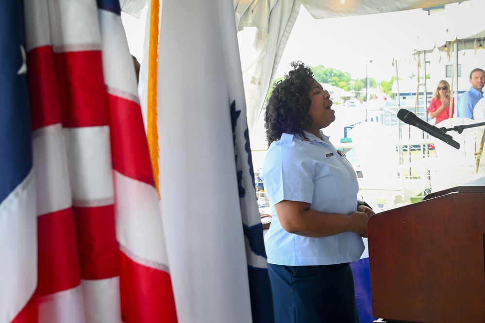 Coast Guard member sings national anthem