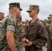 Master Sgt. James C. Orton awards Pvt. Andrew T. Johnson his Eagle, Globe, and Anchor