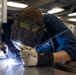 USS Bataan Sailor welds repairs