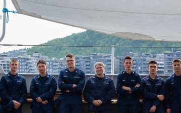 Cadets on USCGC Eagle stand in line for chow