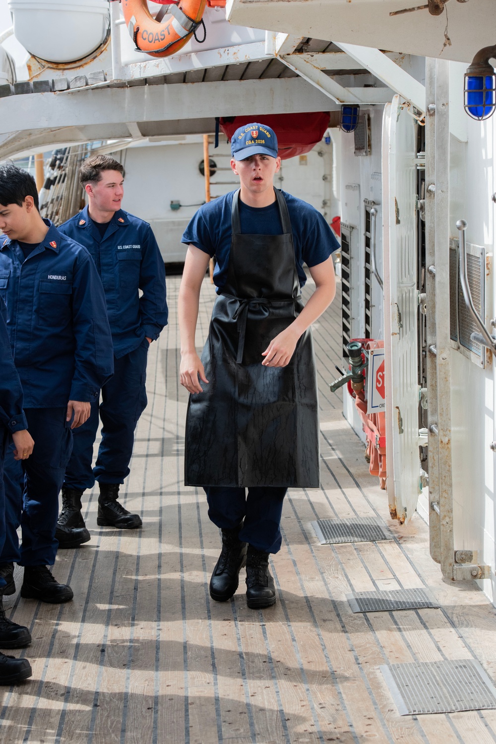 Cadet aboard USCGC Eagle prepares noon meal