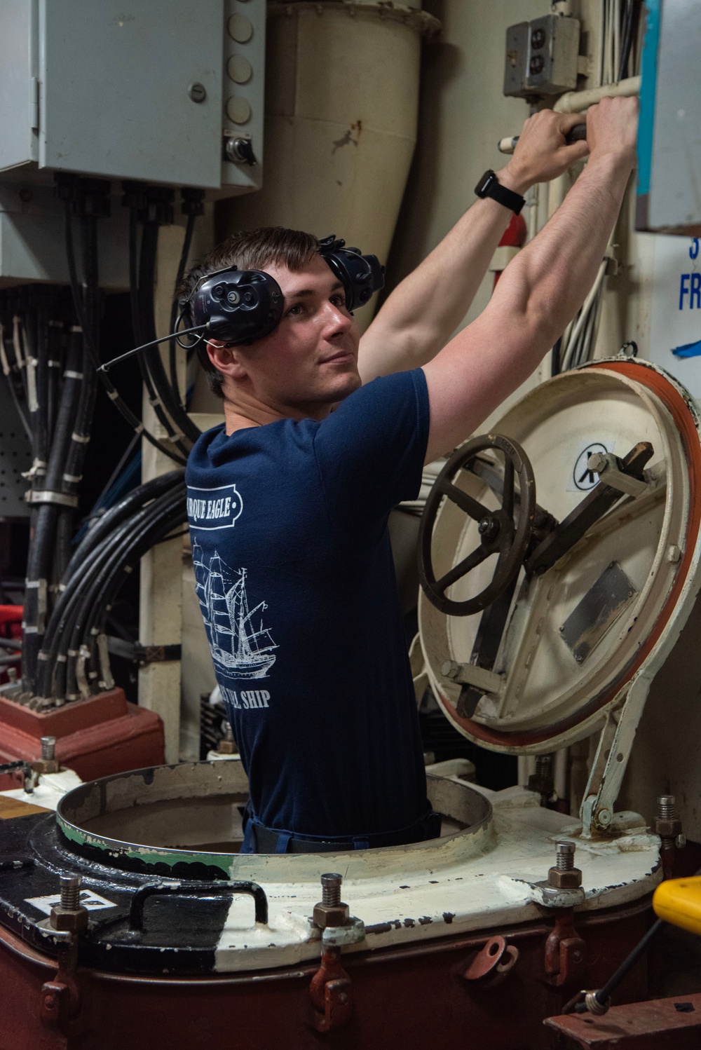 USCGC Eagle crew member performs generator round