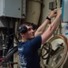 USCGC Eagle crew member performs generator round