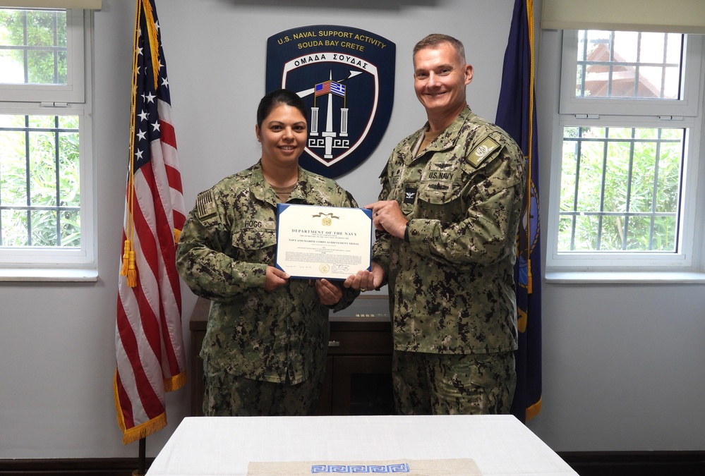 NSA Souda Bay presents MM1 Kira Hogg with a NAM