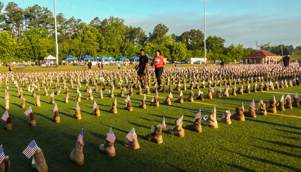 Thousands of boots at Fort Bragg stand in memory of fallen Soldiers.