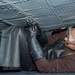 USS Ronald Reagan (CVN 76) Sailors work in the hangar bay