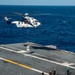 Helicopter Deposits Cargo Onto Flight Deck