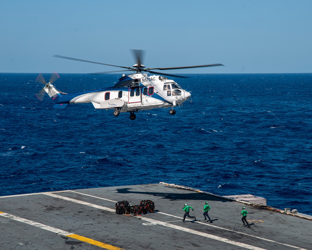 Helicopter Deposits Cargo Onto Flight Deck