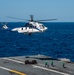 Helicopter Deposits Cargo Onto Flight Deck