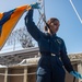 Sailor Prepares To Raise Signal Flag