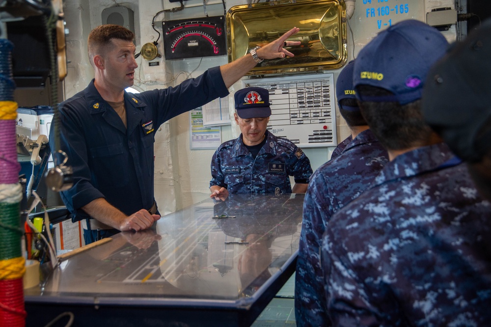 USS Ronald Reagan (CVN 76) Sailors host a tour with members of the Izumo (DDH 183)