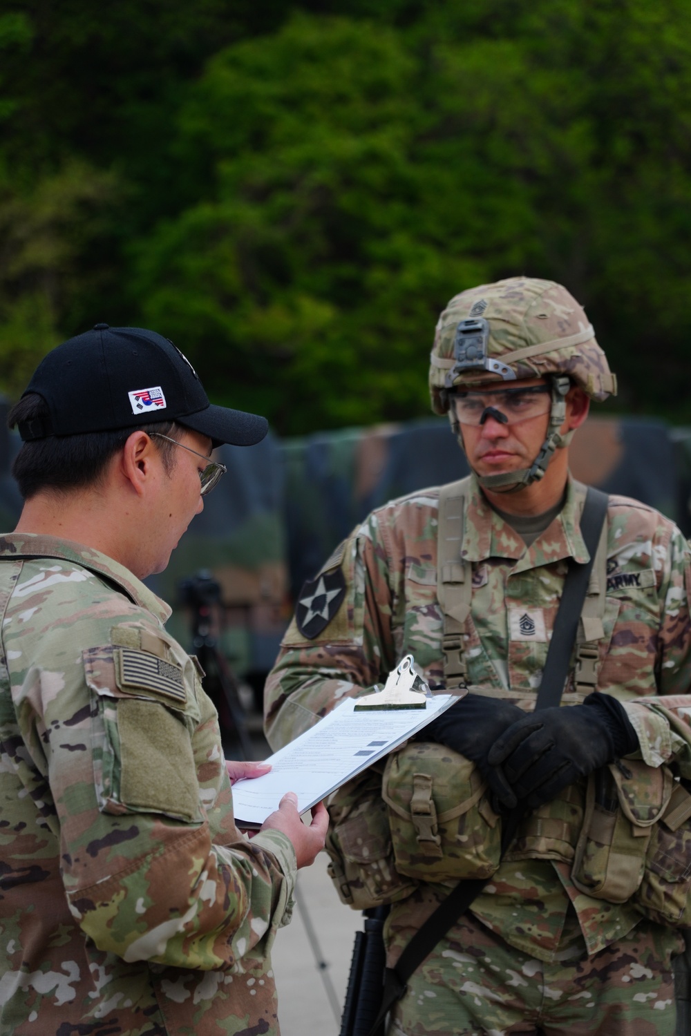 Command Sgt. Maj. Ryan Coles prepares to execute Tactical Combat Casualty Care lane