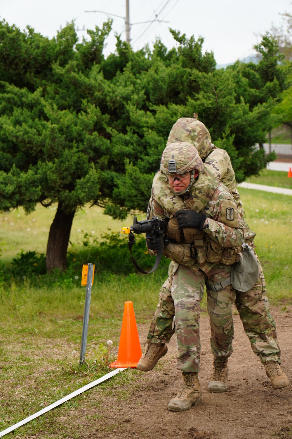 Command Sgt. Maj. Ryan moves a simulated casualty using the one-person carry method