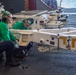 USS Ronald Reagan (CVN 76) Sailors perform maintenance on utility crane