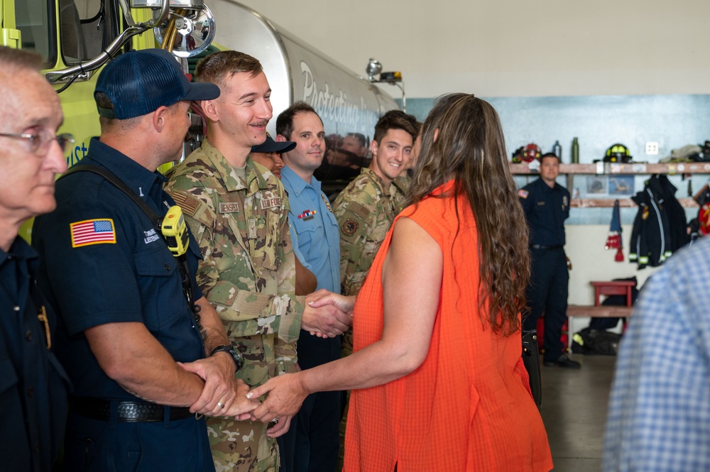U.S. Air Force Airmen from Fairchild Air Force Base greet a family