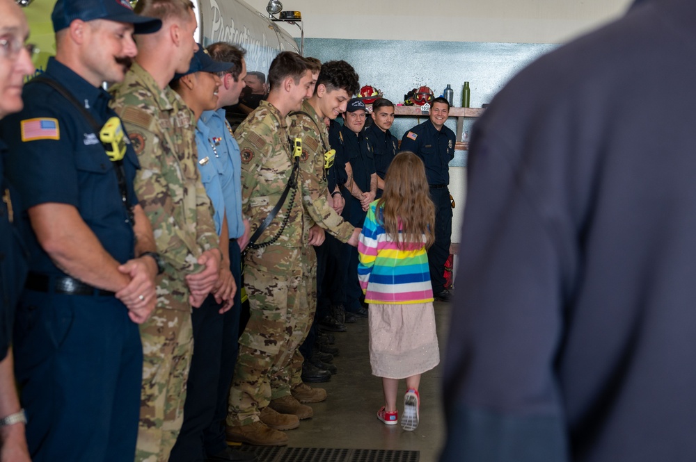 U.S. Air Force Airmen from Fairchild Air Force Base greet a family