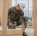Service members help build houses for veterans