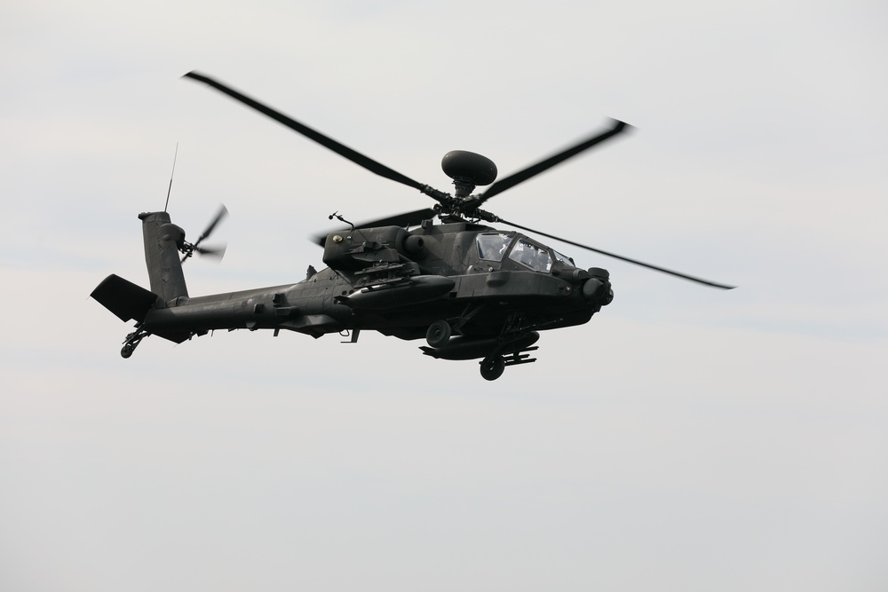 Apache Helicopter flies in response to a call for fire
