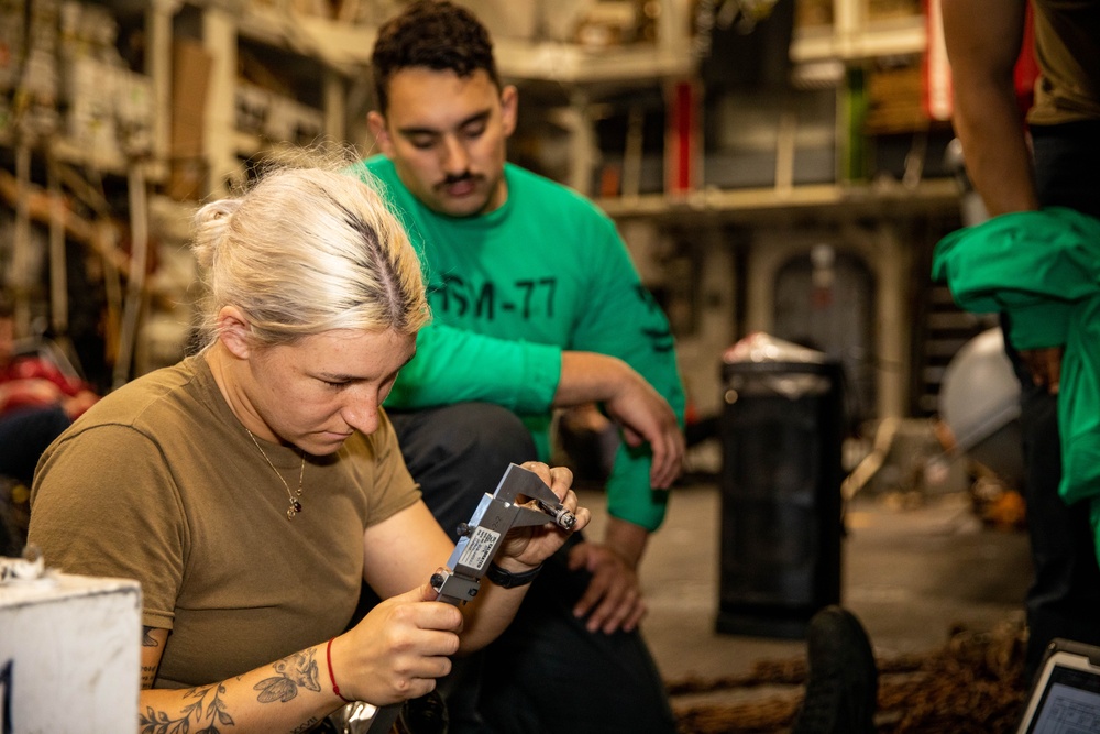 USS Robert Smalls (CG 62) AM3 Conducts Aircraft Maintenance