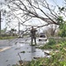 Military Personnel Assist with Debris after Typhoon Mawar