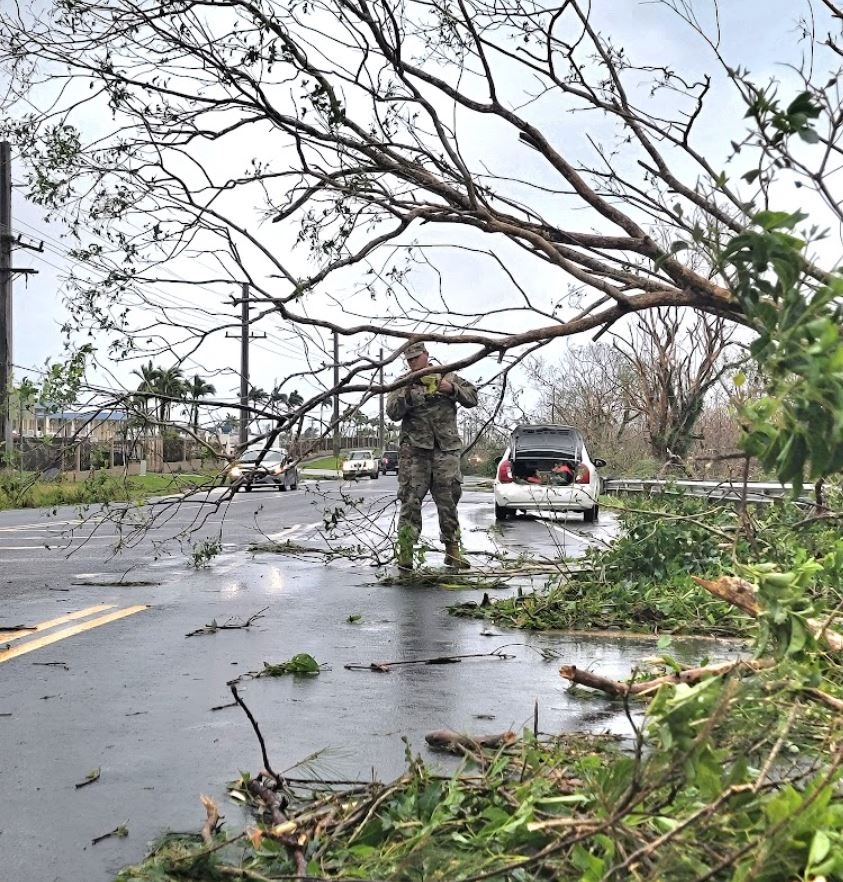 Military Personnel Assist with Debris after Typhoon Mawar