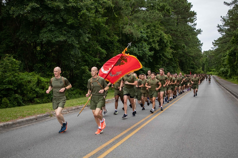 U.S. Marines and Sailors with 2nd Marine Logistics Group participate in a Motivational Regimental Run Honoring Memorial Day