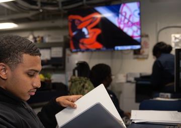 USS Ronald Reagan (CVN 76) Sailors process administrative documents